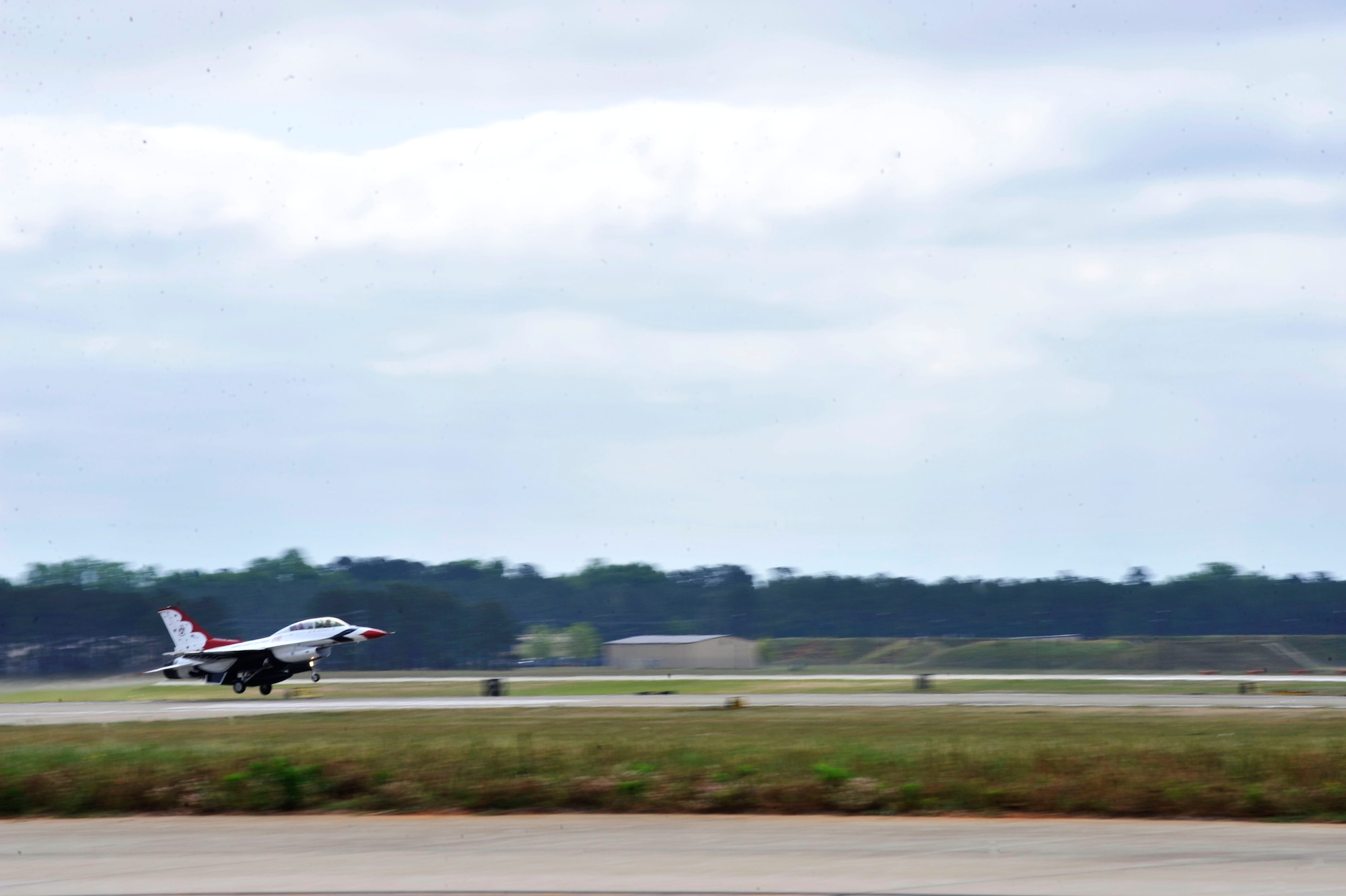 U.S. Air Force Capt. Michael Fisher, U.S. Air Force Air Demonstration Squadron "Thunderbirds" advanced pilot/narrator, and Nick McCormac, Item reporter, depart for a media flight at Shaw Air Force Base, S.C., May 3, 2012.  The Thunderbirds are participating in the Shaw Air Expo May 5 and 6.(U.S. Air Force photo by Airman Nicole Sikorski/Released)