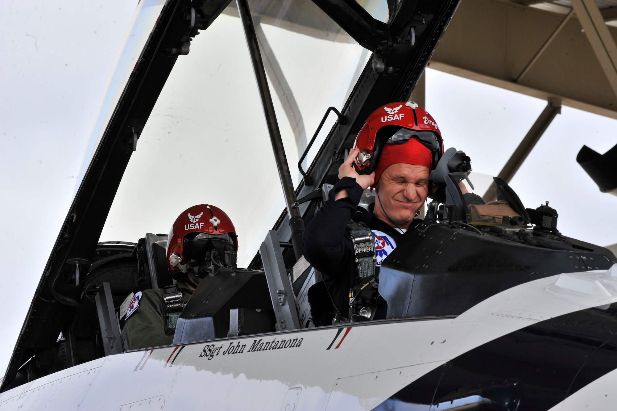 U.S. Air Force Capt. Michael Fisher, U.S. Air Force Air Demonstration Squadron "Thunderbirds" advanced pilot/narrator, and Nick McCormac, Item reporter, prepare for takeoff at Shaw Air Force Base, S.C., May 3, 2012. The Thunderbirds are participating in the Shaw Air Expo May 5 and 6.(U.S. Air Force photo by Airman Nicole Sikorski/Released)