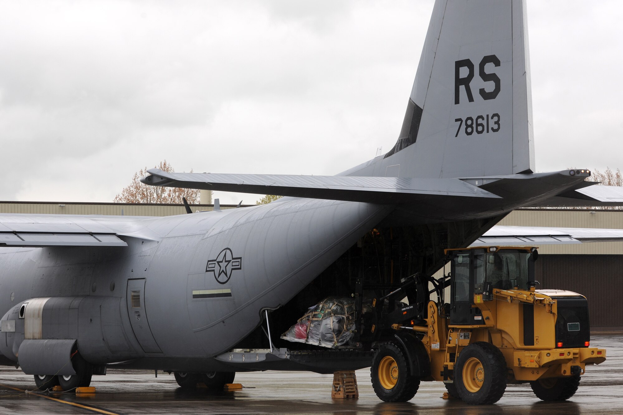 RAF FAIRFORD, United Kingdom - Airmen stationed at Ramstein Air Base, Germany, unload a C-130J assigned to the 86th Airlift Wing during an exercise here April 23. The airfield is capable of receiving aircraft within just a few hours notice. (U.S. Air Force photo by Senior Airman Joel Mease)