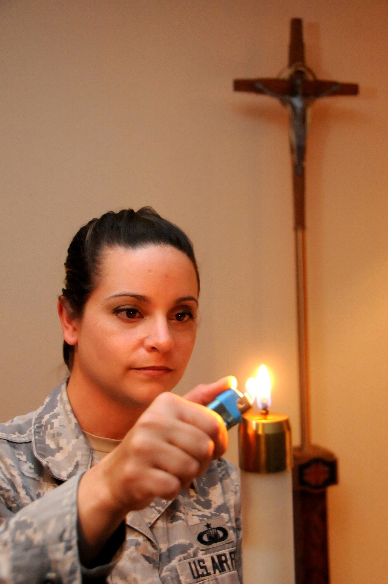 U.S. Air Force Tech. Sgt. Carrie Sexton, 386th Air Expeditionary Wing Chapel chaplain assistant, prepares for Catholic Mass at an undisclosed location, Southwest Asia, April 28, 2012. Sexton is deployed from the 2d Bomb Wing, Barksdale Air Force Base, La. (U.S. Air Force photo/Staff Sgt. James Lieth)