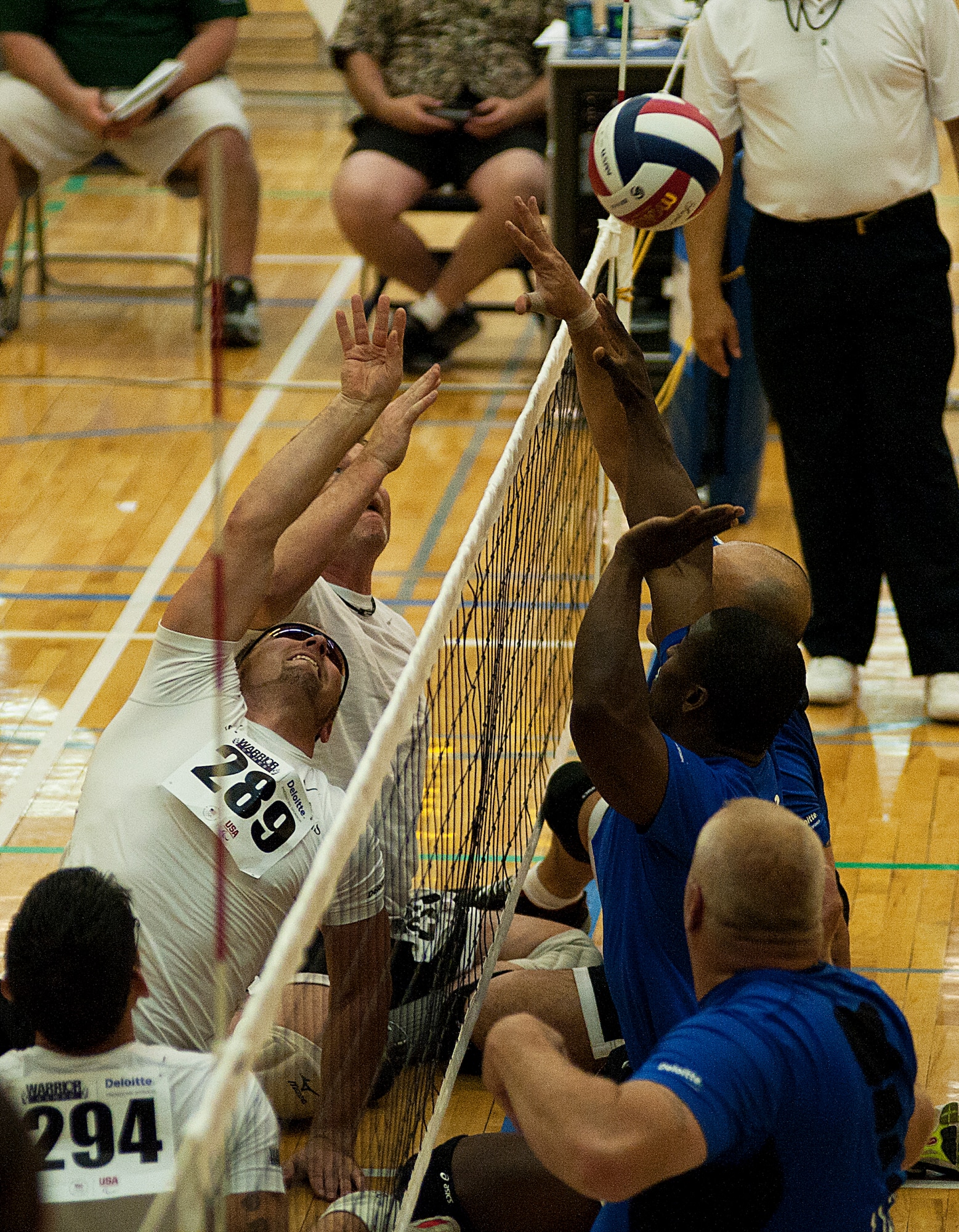 Members of the Air Force and Special Operations Command sitting volleyball teams battle for the bronze medal during the 2012 Warrior Games at the U.S. Air Force Academy in Colorado Springs, Colo., May 3, 2012. Air Force won by a score of 25-12 and 25-20. (U.S. Air Force photo/Val Gempis)