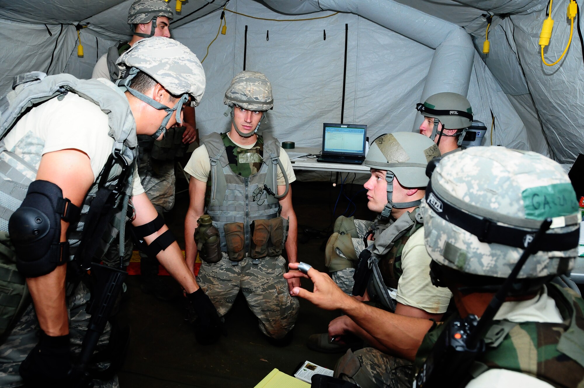 ANDERSEN AIR FORCE BASE, Guam-- The 644th Combat Communications Squadron leadership gives junior Airmen guidance on how to lead and manage the Communications Focal Point during a firefight scenario, April 24 in forward operating base Dragon Hill. FOB Dragon Hill is the location for Dragon Thunder, an exercise where the 644 CBCS train and test their capabilities in a bare-base environment.  (U.S. Air Force photo by Airman 1st Class Marianique Santos)