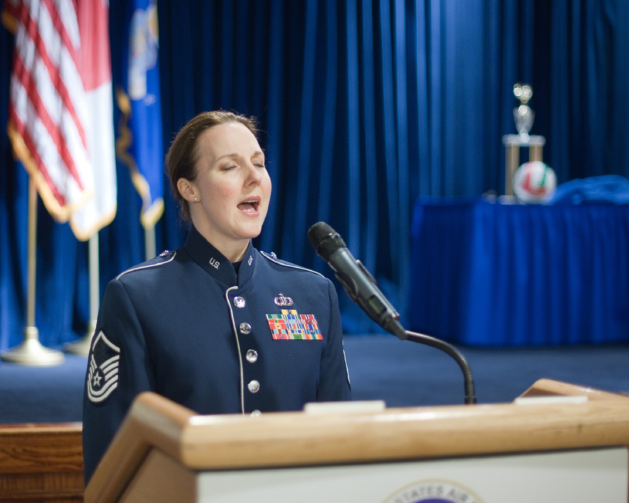 YOKOTA AIR BASE, Japan -- Master Sgt. Paula Goetz, Band of the Pacific-Asia vocalist, sings Japanese and U.S. national anthems during the Airman Leadership School Class 12-Delta graduation ceremony at Yokota Air Base, Japan, May 3, 2012. Twenty Airmen graduated from the class and will become the Air Force's newest NCOs. (U.S. Air Force photo/Osakabe Yasuo)