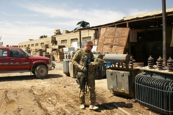 AFGHANISTAN — Staff Sgt. James Gray, deployed from Schofield Barracks, Hawaii, inspects the failed transformer at Breshna Kot in Kandahar City in late April. Gray is assigned to Task Force Breshna Barq, the U.S. Army Corps of Engineers electrical power team in Afghanistan.