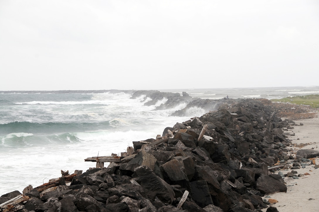 Mouth of Columbia River, south jetty

Just as bridges provide safe passage over rivers, gorges or other depressions, jetties built by the U.S. Army Corps of Engineers help ocean-going vessels move between coastal rivers and the Pacific Ocean.  Simply put, jetties are rock fingers which stretch out into the ocean from the beaches, essentially extending the mouths of the rivers well into the sea. 
Jetties were never intended to be used for recreational purposes. Powerful waves remove or shift even the largest boulders from the jetties, while underwater currents penetrate the structure, and remove smaller rocks and sand from inside the jetty, creating unique dangers. Some dangers are apparent, such as slippery rock surfaces and strong waves overtopping the structure. Other dangers are hidden and include open crevasses, sinkholes and caverns that are caused by the ocean eroding away stones and sand just below the surface of the jetty.
Learn more about coastal jetties at http://www.nwp.usace.army.mil/pa/docs/pubs/jetty.pdf
