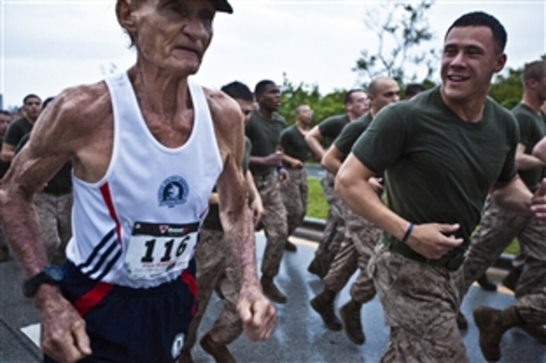 Martin Oliver, a U.S. Army veteran, runs with Marine Corps Cpl. Rob Velasquez and members of the 26th Marine Expeditionary Unit during the Fort Lauderdale Rotary U.S. Military 5K at Dania Beach, Fla., April 29, 2012. Marines and sailors assigned to the 26th Marine Expeditionary Unit are currently providing support to Fleet Week Port Everglades in order to showcase the strength and flexibility of today's Navy-Marine Corps team. 