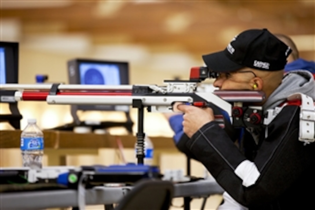 Veteran Marine Corps Cpl. Angel E. Gomez aims in during the air-rifle portion of the shooting competition in the 2012 Warrior Games at the Olympic Training Center in Colorado Springs, Colo., May 3, 2012. The All-Marine Warrior Games shooting team took eight gold, seven silver and five bronze medals, claiming 20 out of 24 medals for the second year in a row.