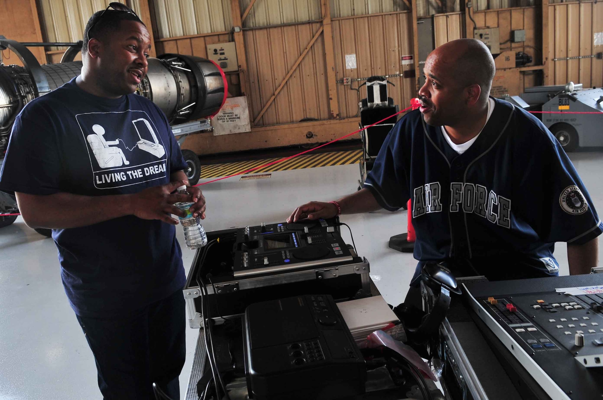 U.S. Air Force Staff Sgt. Kelcey McDonald and Technical Sgt. Ronicle Ellison, both members of the Blue Aces Band, enjoy a break after a big performance during the 2012 Shaw Air Expo while at Shaw Air Force Base, S.C., May 5, 2012. The band was one of many forms of entertainment held at the biennial event, which was highlighted with performances by the U.S. Golden Knights and the U.S. Thunderbirds.  (U.S. Air Force photo by Airman 1st Class Ashley L. Gardner/ Released)