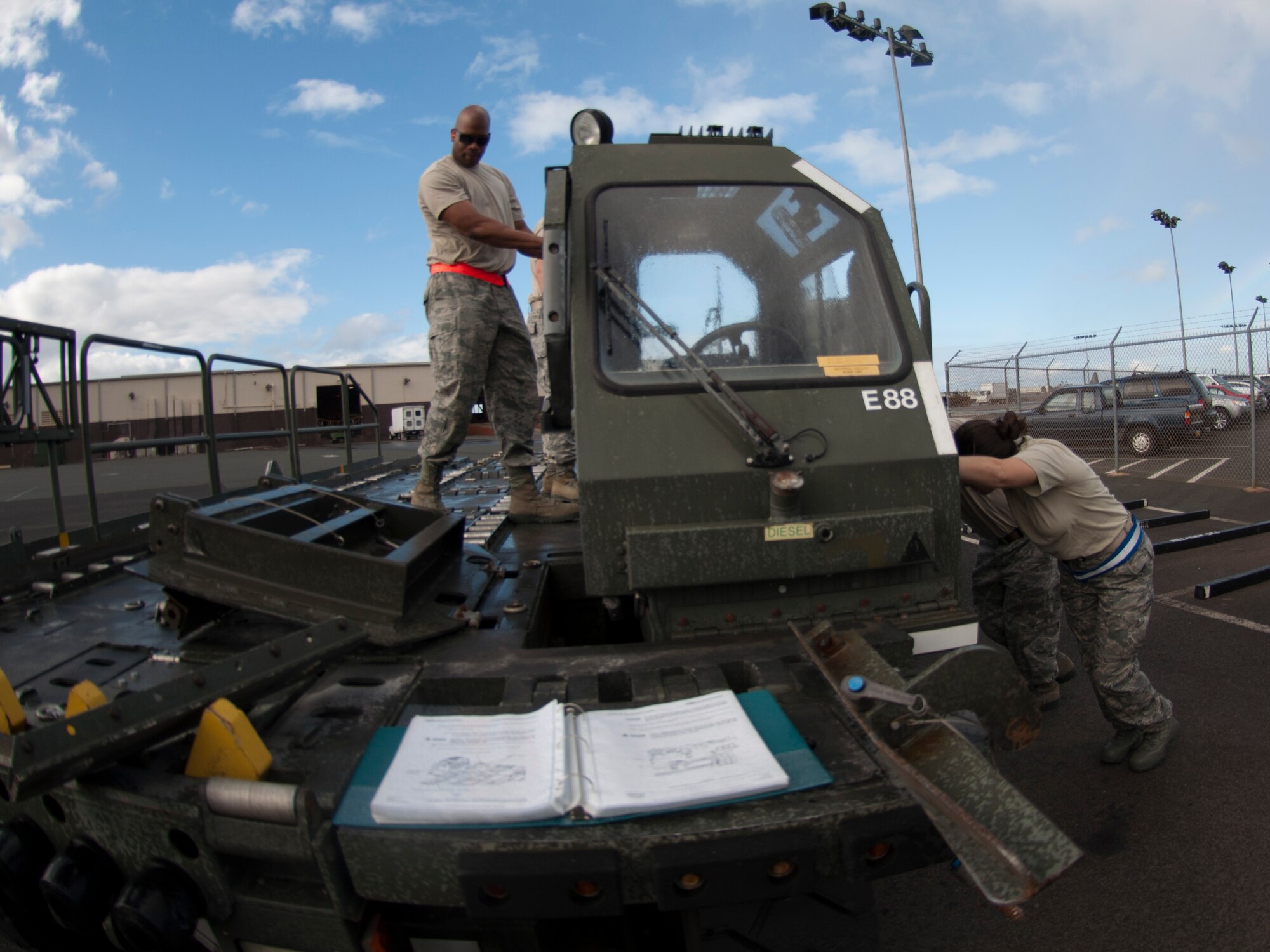 JOINT BASE PEARL HARBOR-HICKAM, Hawaii- Members of the 48th Aerial Port Squadron reposition the cab of a cargo loader for transport. Training also included classroom work and a load mission on an aircraft. The loader is used to load and unload cargo aircraft and the aerial porters must mainitain their qualifications with a annual refresher course. 



 (U.S. Air Force photo/Staff Sgt. Kyle Brasier)