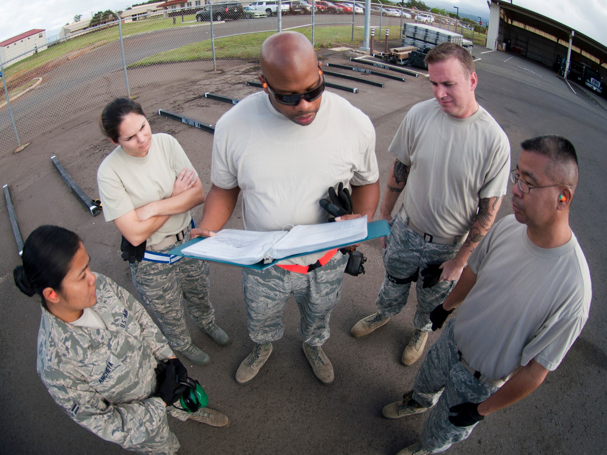 JOINT BASE PEARL HARBOR-HICKAM, Hawaii- Members of the 48th Aerial Port Squadron go over the proper procedures for reconfiguring a cargo loader for transport. Training also included classroom work and a load mission on an aircraft. The loader is used to load and unload cargo aircraft and the aerial porters must mainitain their qualifications with a annual refresher course. (U.S. Air Force photo/Staff Sgt. Kyle Brasier)