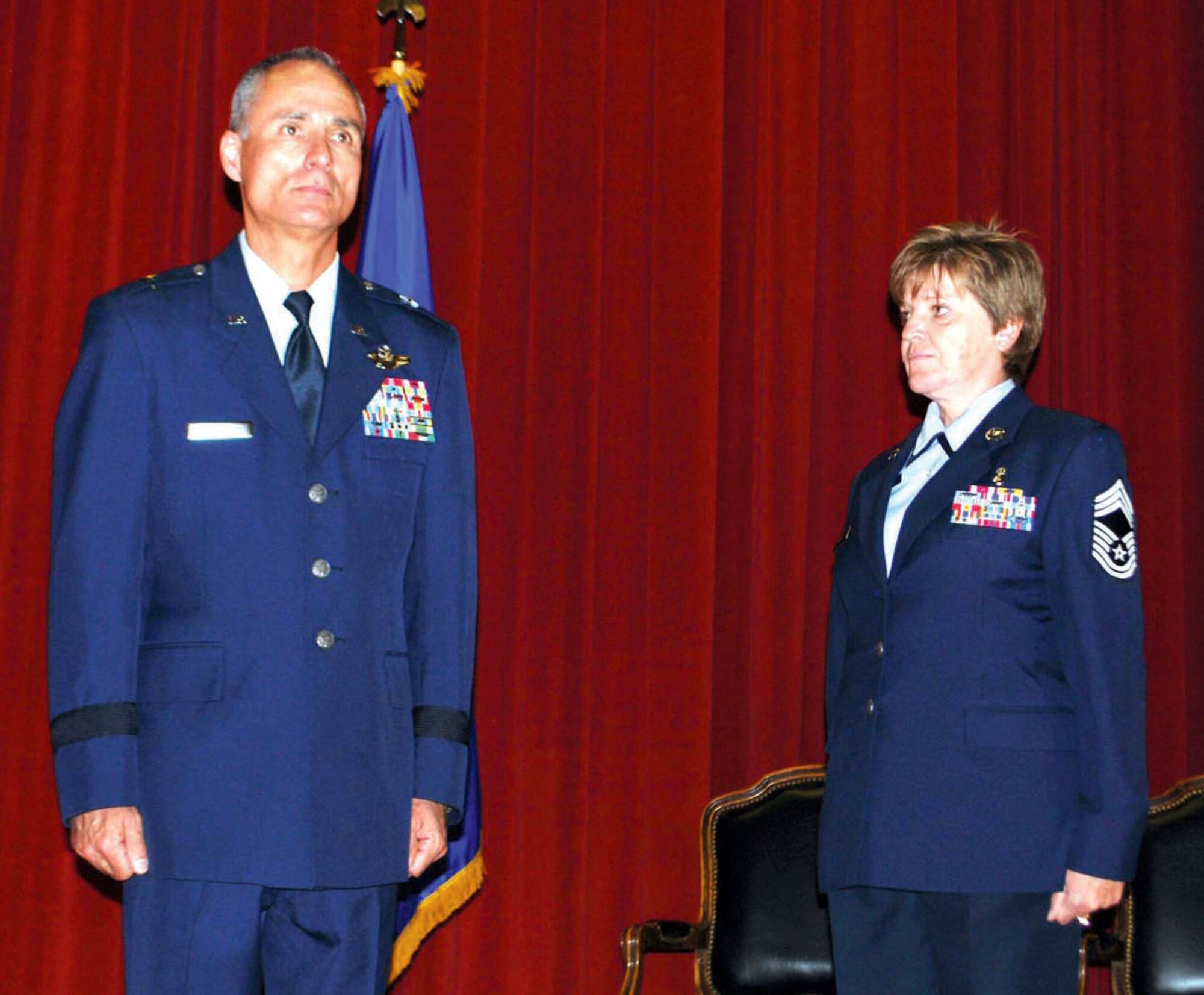 Brig.Gen. Karl McGregor, 452 Air Mobility Wing Commander and presiding official, accompanied by Chief Master Sgt. Cheryl Wente, acting 452 AMW Command Chief and guest speaker attend the March Field Induction Ceremony, held on April 22 at the
Cultural Resource Center. (U.S. Air Force photo)