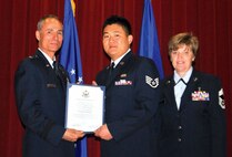 March Field held its Senior NCO and NCO induction ceremony, April 22, at the
Cultural Resource Center. SSgt James C. Chen, 452 FSS receives his certificate
of induction into the NCO ranks. (U.S. Air Force photo)