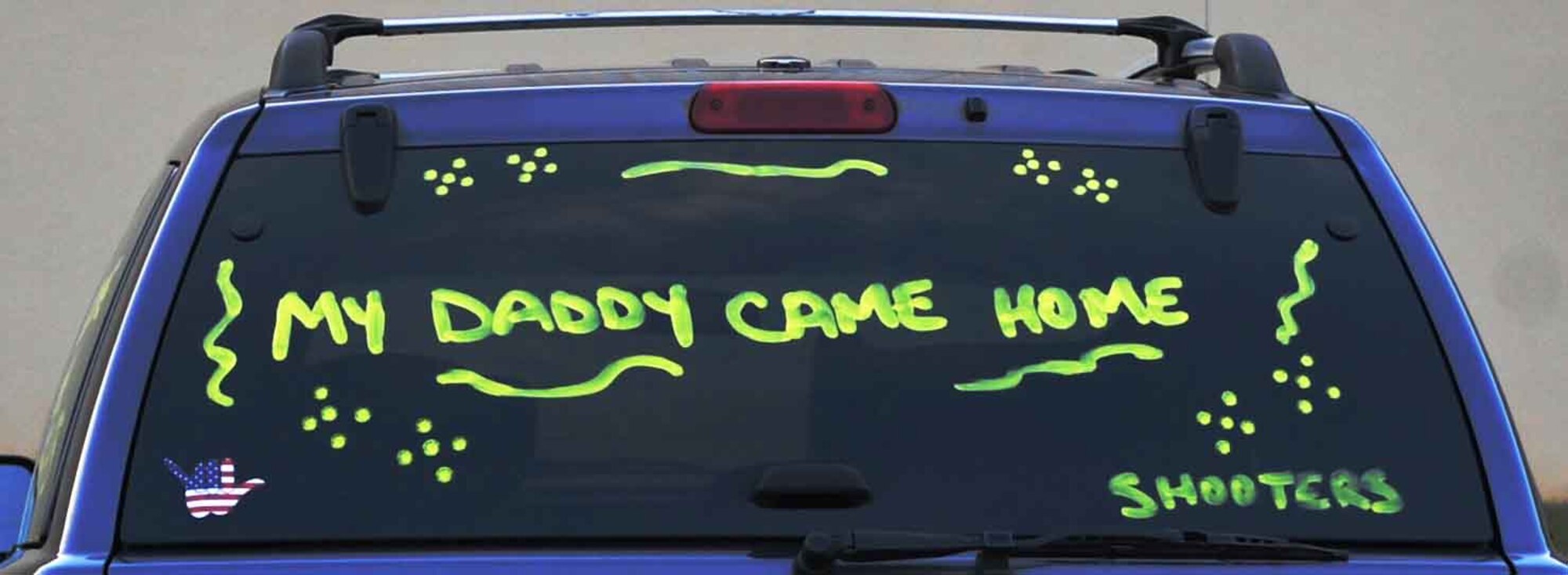 Families and friends welcome back airmen returning from deployment with decorated cars and signs at Shaw Air Force Base, S.C., May 4, 2012. 235 members of the 55th Expeditionary Fighter Squadron returned from a four-month deployment to Kunsan AB, Republic of Korea. (U.S. Air Force photo by Airman 1st Class Ashley L. Gardner/ Released)