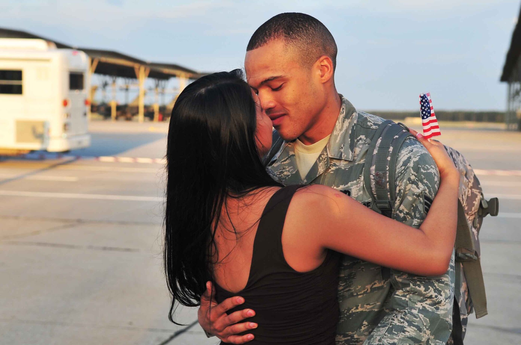 U.S. Air Force Staff Sgt. Jessica Bundle, a supply liaison assigned to the 20th Component Maintenance Squadron greets her husband Senior Airman Sean Bundles, a avionics technician currently assigned to the  20th CMS, upon his return to Shaw Air Force Base, S.C., May 4, 2012. Bundles completed a four-month deployment to Kunsan Air Base, Republic of Korea as a member of the 55th Expeditionary Squadron. (U.S. Air Force photo by Airman 1st Class Ashley L. Gardner/ Released)