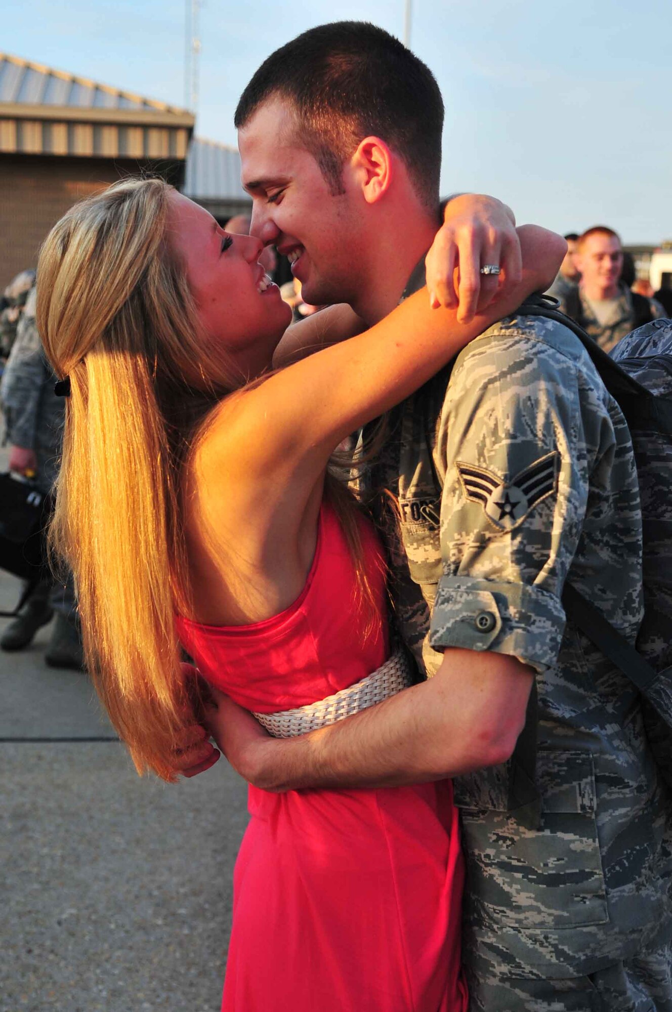 U.S. Air Force Senior Airman Keith Palaka, 55th Maintenance Squadron crew chief, reunites with his wife Courtney Palaka at Shaw Air Force Base, S.C., May 4, 2012. Palaka, along with 234 members of the 55th Expeditionary Fighter Squadron returned home from a four-month deployment at Kunsan AB, Republic of Korea. (U.S. Air Force photo by Airman 1st Class Ashley L. Gardner/ Released)