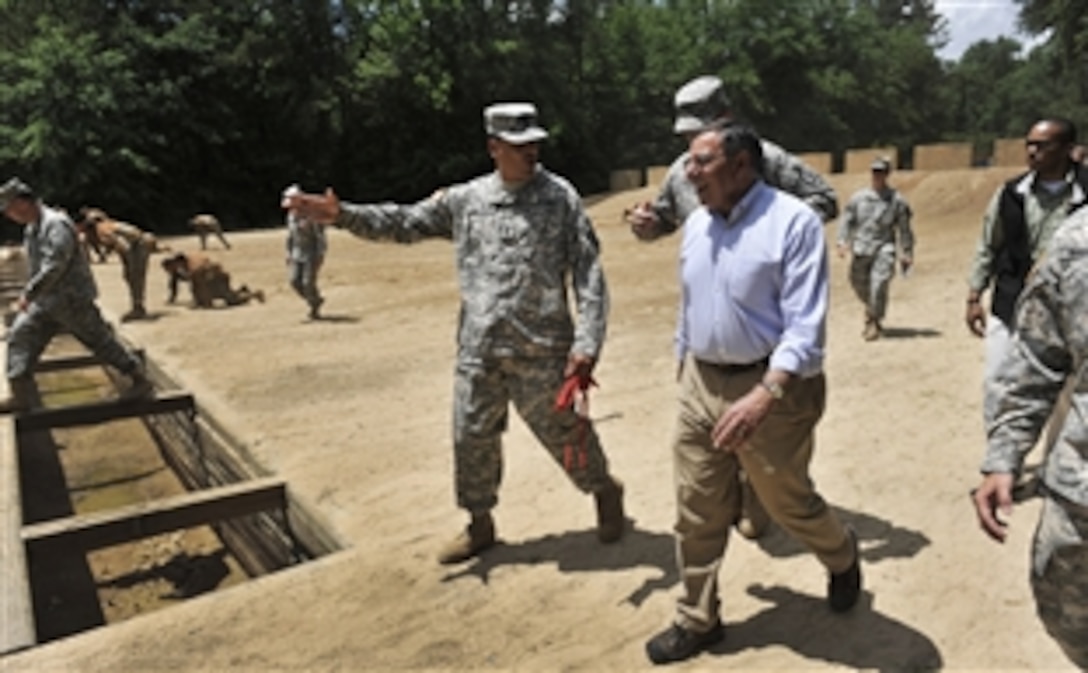 Defense Secretary Leon E. Panetta watches as soldiers in basic training run an obstacle course on Fort Benning, Ga., May 4, 2012. Panetta later addressed the 3rd Heavy Brigade Combat Team of the U.S. Army’s 3rd Infantry Division during a town hall address. 