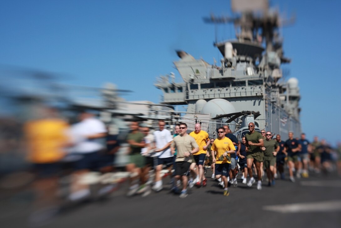 Marines with the 11th Marine Expeditionary Unit and sailors aboard USS Makin Island run here May 5. The unit is deployed as part of the Makin Island Amphibious Ready Group, currently a U.S. Central Command theater reserve force. The group is providing support for maritime security operations and theater security cooperation efforts in the U.S. Navy's 5th Fleet area of responsibility.