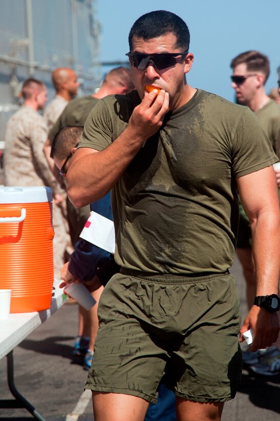 Sgt. Michael W. Carter eats an orange after a 5-kilometer run aboard USS Makin Island here May 5. The 25-year-old squad leader hails from Santa Ana, Calif., and serves with Battalion Landing Team 3/1, the ground combat element for the 11th Marine Expeditionary Unit. The unit is deployed as part of the Makin Island Amphibious Ready Group, currently a U.S. Central Command theater reserve force. The group is providing support for maritime security operations and theater security cooperation efforts in the U.S. Navy's 5th Fleet area of responsibility.