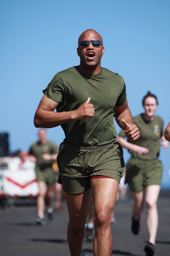 Master Gunnery Sgt. Wilbert Haverly runs aboard USS Makin Island here May 5. Haverly serves as the operations chief with the 11th Marine Expeditionary Unit’s command element. The unit is deployed as part of the Makin Island Amphibious Ready Group, currently a U.S. Central Command theater reserve force. The group is providing support for maritime security operations and theater security cooperation efforts in the U.S. Navy's 5th Fleet area of responsibility.