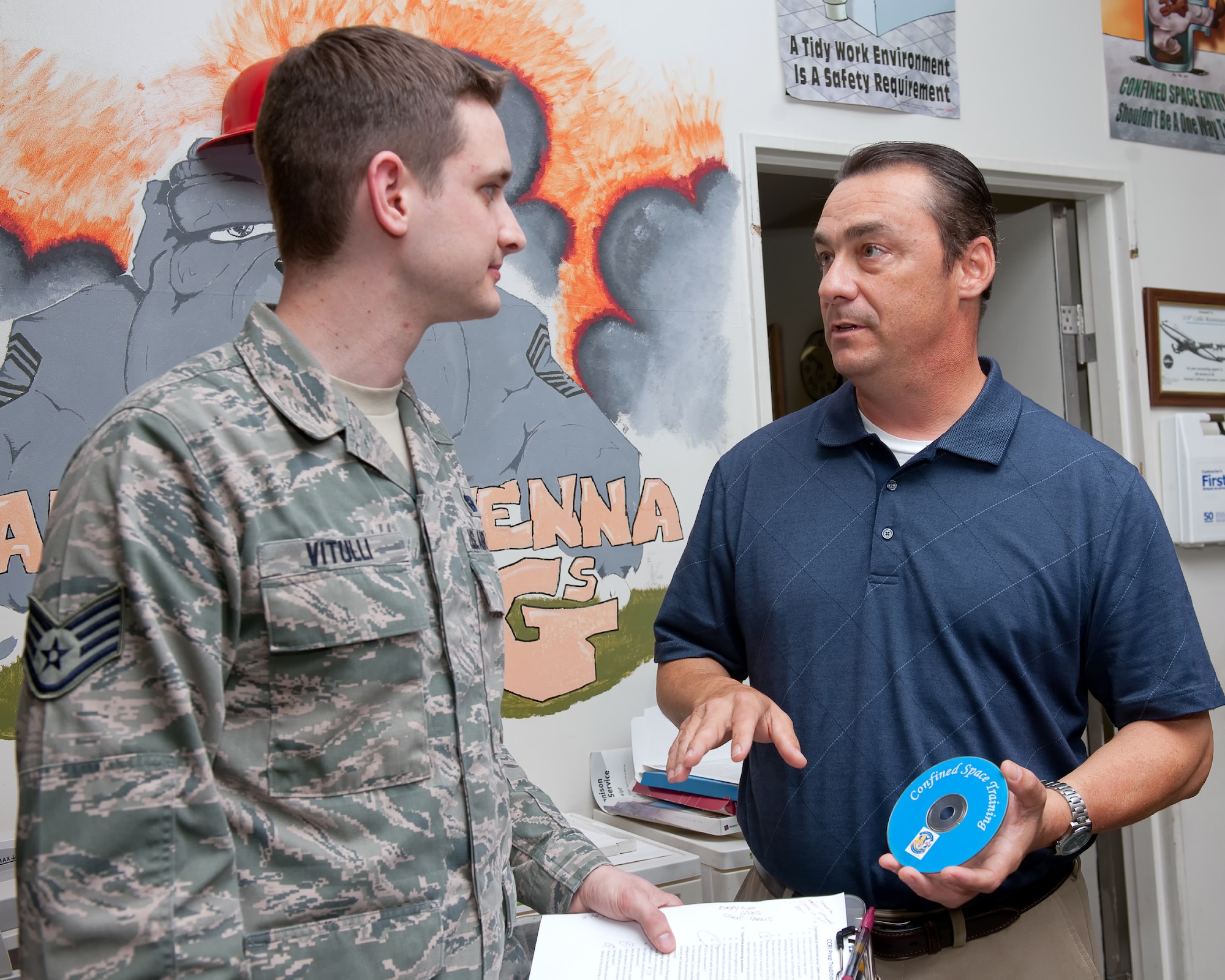 YOKOTA AIR BASE, Japan -- Glenn Keppler, right, Command Cyber Readiness Inspection Team traditional reviewer, inspects unclassified material with Staff Sgt. Thomas Vitulli, left, 374th Communications Squadron wing information assurance manager, in the 374th CS office during CCRI at Yokota Air Base, Japan, May 3, 2012.  The Defense Information Systems Agency conducted the 374th Airlift Wing's CCRI from April 30 to May 4. Team Yokota has earned the best combined CCRI score in the Air Force to date for fiscal 2012. (U.S. Air Force photo by Osakabe Yasuo)  