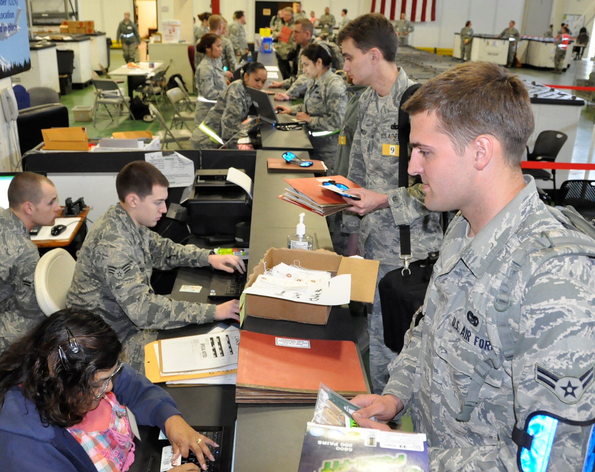 Team McChord Airmen, both active duty and Reserve, process through a deployment line for a fly-away operational readiness exercise May 6. More than 300 Airmen from various squadrons travelled on C-17 Globemasters to an undisclosed deployed location where they will simulate 24-hour operations in a combat zone. This exercise is in preparation for the operational readiness inspection set for October. (U.S. Air Force photo/Staff Sgt. Rachael Garneau)
