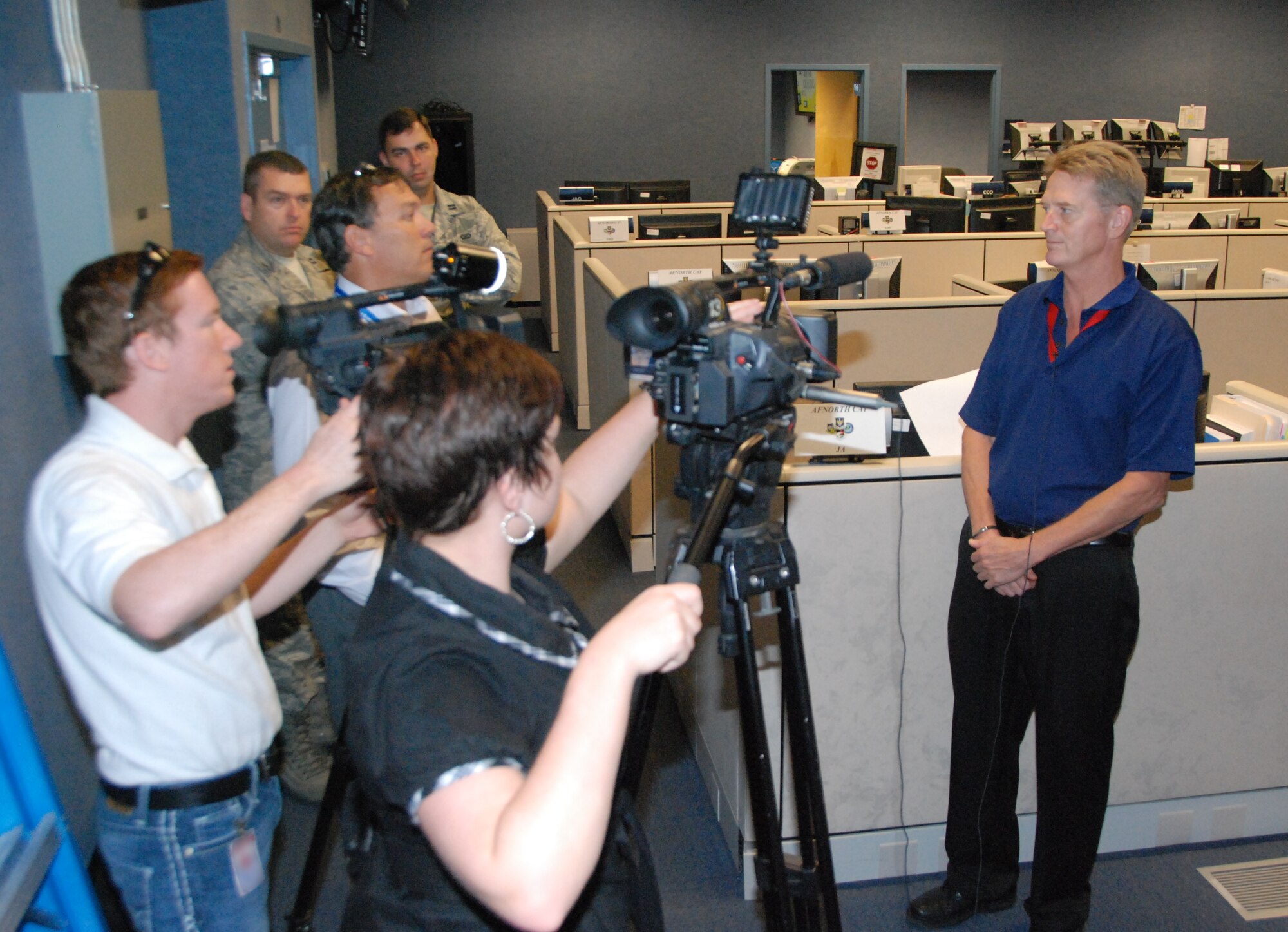 Local television stations Channel 7 and Channel 13 interview Tom Pieknik, National Security Emergency Preparedness coordinator, while reporting on Air Force Northern’s participation in Ardent Sentry 12. 