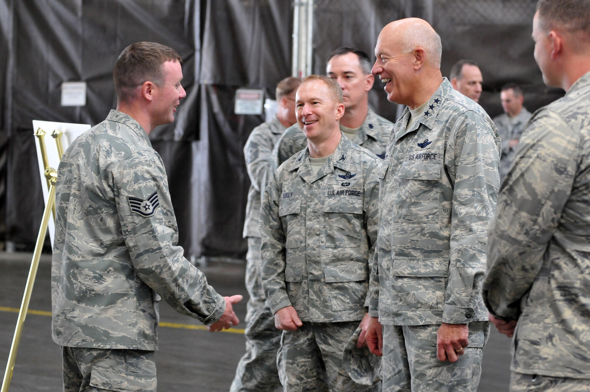 Lt. Gen. Harry (Bud) Wyatt and Col. Richard Kelley talk with Staff Sgt. Trevor Volack from the 141st AMXS. (U.S. Air Force Photo by Staff Sgt. Anthony Ennnamorato) 