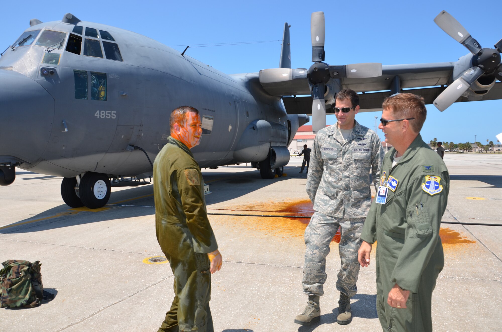 Master Sgt. Rob Grande, radio operator shop chief, 39th rescue squadron, Patrick Air Force Base, Fla., chats with Col. Mark Blalock, 920th Operations Group commander and 1st Lt. Daniel Morgese, HC-130P/N refueling aircraft pilot, 39th RQS following his fini-flight. Grande has been a reservist for 12 years. (U.S. Air Force photo/Senior Airman Natasha Dowridge)