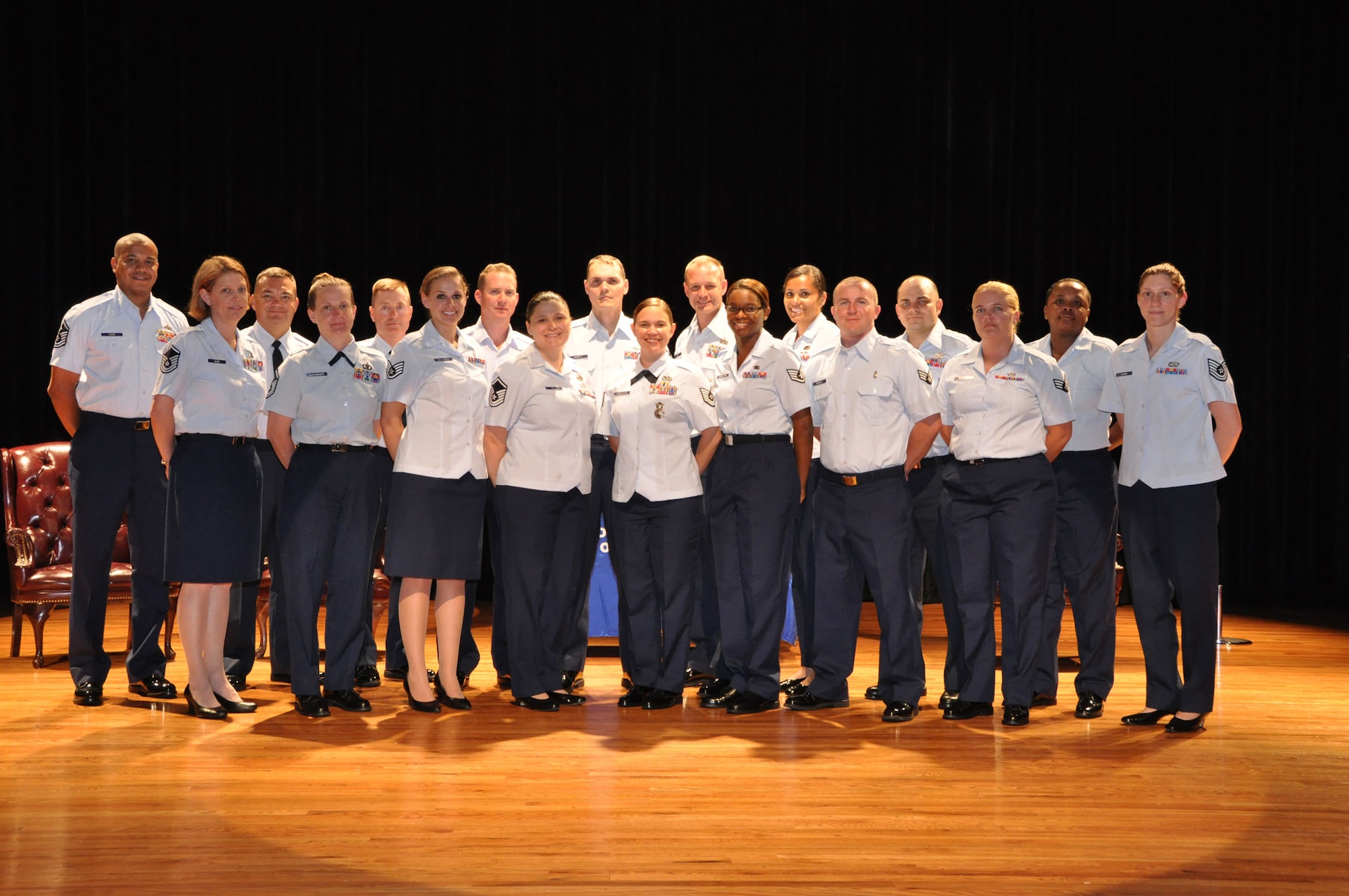 Airmen assigned to the 315th Airlift Wing at Joint Base Charleston, S.C. parcipate in the graduation ceremony for earning degrees from the Community College of the Air Force May 6, 2012.  Leadership, fellow airmen, family and friends attended the ceremony, which was hosted at the base theater at JB CHS. (U.S. Air Force photo/Senior Airman Bobby Pilch)