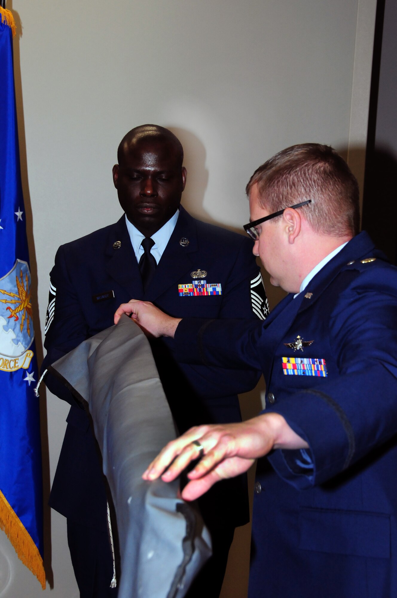 Maj. Cynthia Marcello assumed command of the 310th Force Support Squadron from the outgoing commander, Lt. Col. Kevin Graefe, at a change-of-command ceremony on April 15 at the newly completed Air Reserve Personnel Center at Buckley Air Force Base, Colo. (U.S. Air Force Photo/Staff Sgt. Jeffrey Fitzmorris)