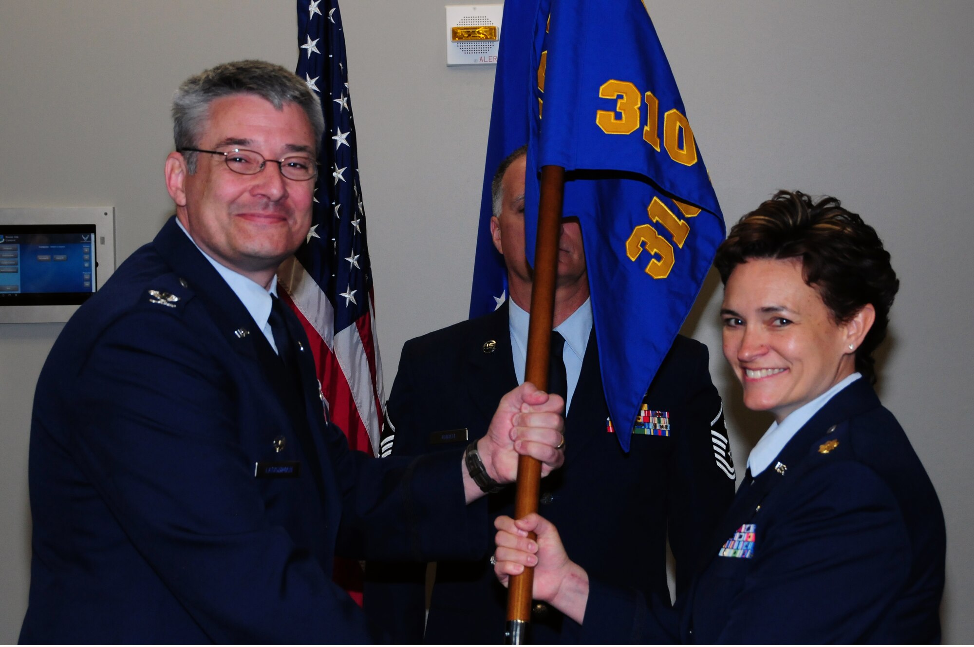 Maj. Cynthia Marcello assumed command of the 310th Force Support Squadron from the outgoing commander, Lt. Col. Kevin Graefe, at a change-of-command ceremony on April 15 at the newly completed Air Reserve Personnel Center at Buckley Air Force Base, Colo. (U.S. Air Force Photo/Staff Sgt. Jeffrey Fitzmorris)