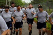Reservists from teh 916th Air Refueling Wing are all smiles at the wing's semi-annual Warrior Run kicks off on Sunday, May 6, 2012. The two-mile walk/run is held as a wing morale event. (USAF photo by Tech. Sgt. Scotty Sweatt, 916ARW/PA, released)