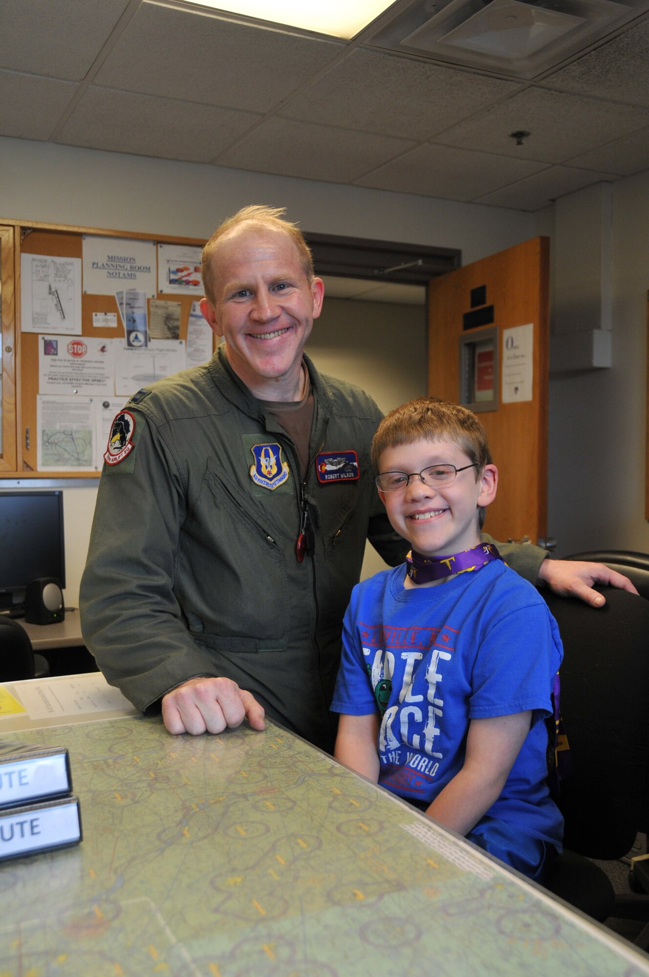 A.J. Neppl meets Air Force Reserve Captain Robert Wilson, a pilot from the 302nd Airlift Wing, Peterson Air Force Base, Colo., for the first time at Minneapolis-St. Paul Air Reserve Station, Minn.  It has been almost 3 years since Capt. Wilson donated lifesaving bone marrow to the then 7 year old boy. (U.S. Air Force Photo/Tech. Sgt. Bob Sommer)