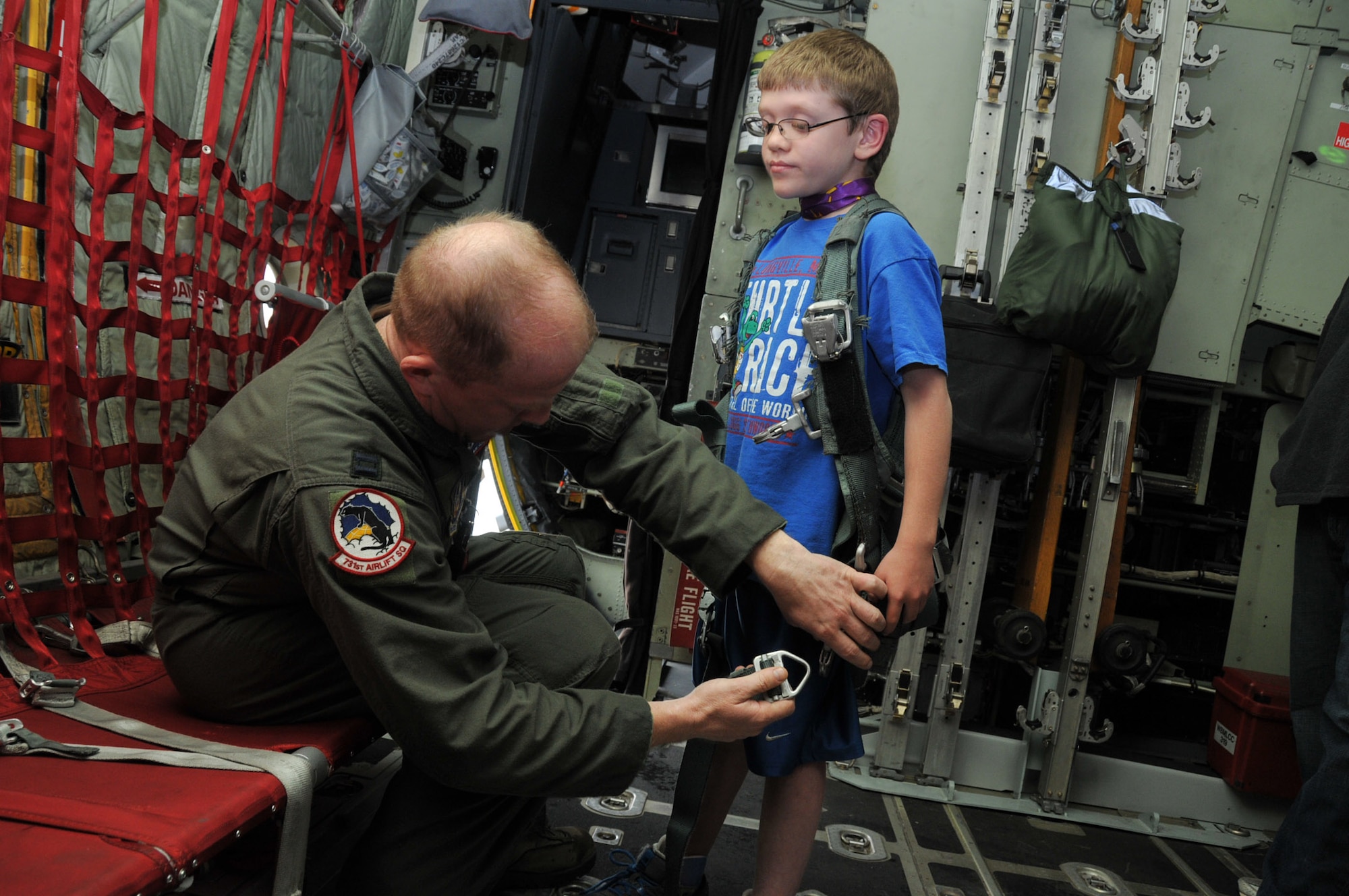 A.J. Neppl of Apple Valley, Minn., gets a tour of a C-130 from Air Force Reserve Captain Robert Wilson, a pilot with the 302nd Airlift Wing, Peterson Air Force Base, Colo.  The two met for the first time at Minneapolis-St. Paul Air Reserve Station, almost 3 years after Capt. Wilson donated lifesaving bone marrow to the then 7 year old boy.  (U.S. Air Force Photo/Tech. Sgt. Bob Sommer)