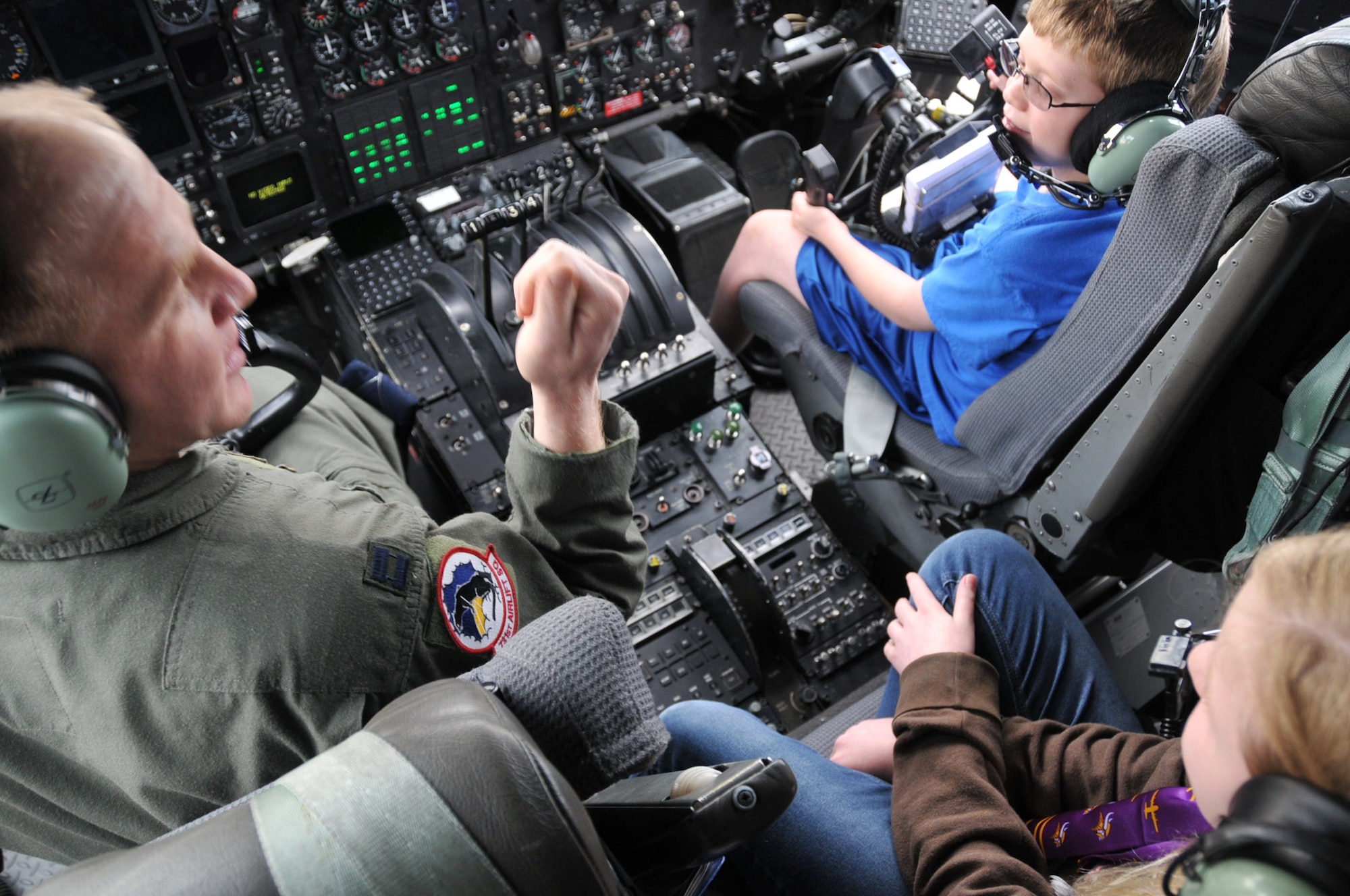A.J. Neppl and his family of Apple Valley, Minn., get a tour of a C-130 from Air Force Reserve Captain Robert Wilson, a pilot with the 302nd Airlift Wing, Peterson Air Force Base, Colo.  They met for the first time at Minneapolis-St. Paul Air Reserve Station, almost 3 years after Capt. Wilson donated lifesaving bone marrow to the then 7 year old boy.  (U.S. Air Force Photo/Tech. Sgt. Bob Sommer)