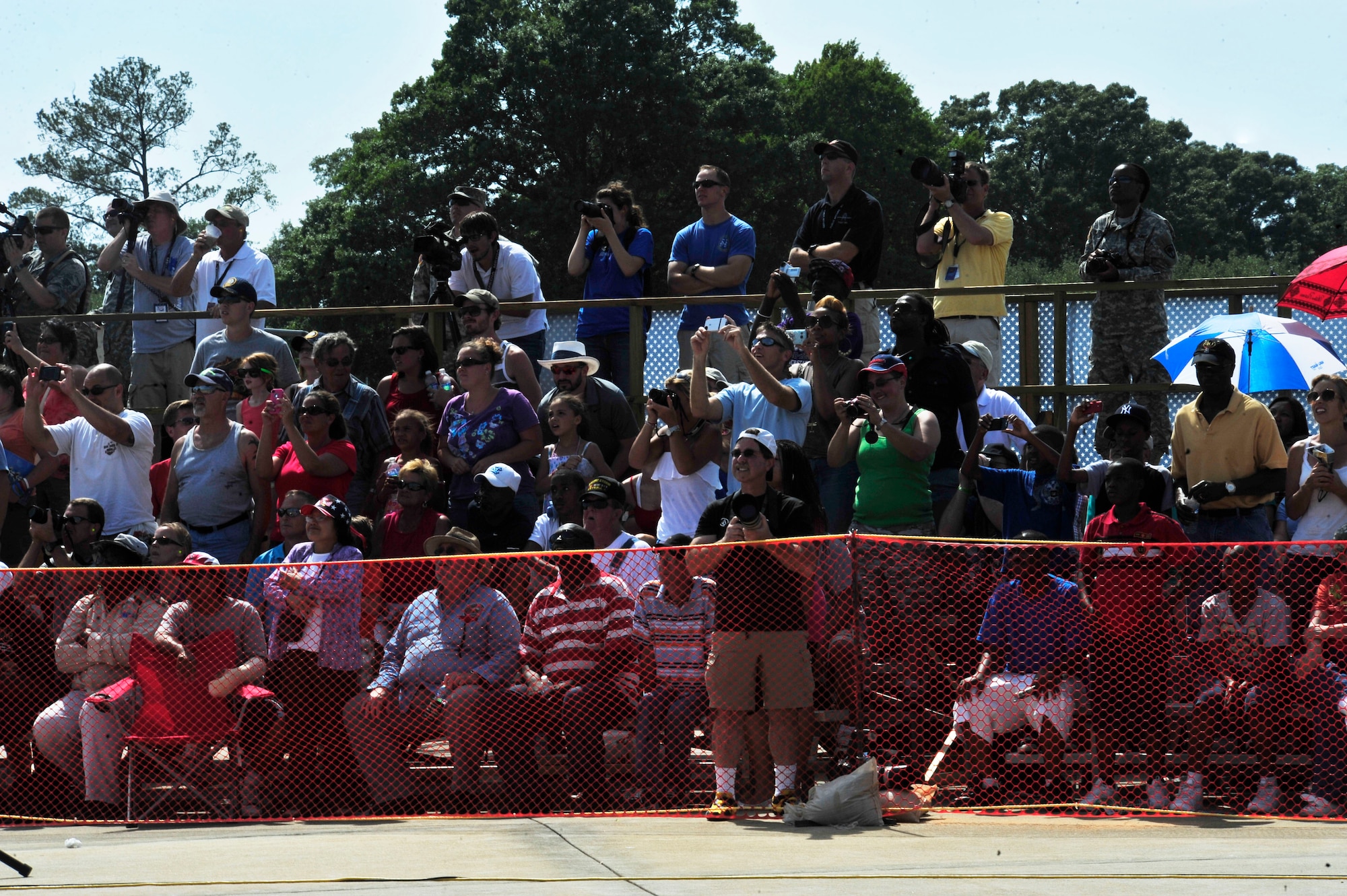 Crowd members gather and gaze at the performance of the U.S. Air Force Air Demonstration Squadron "Thunderbirds" during the Shaw Air Expo held at Shaw Air Force Base, S.C., May 5, 2012. (U.S. Air Force photo by Airman Nicole Sikorski/Released) 