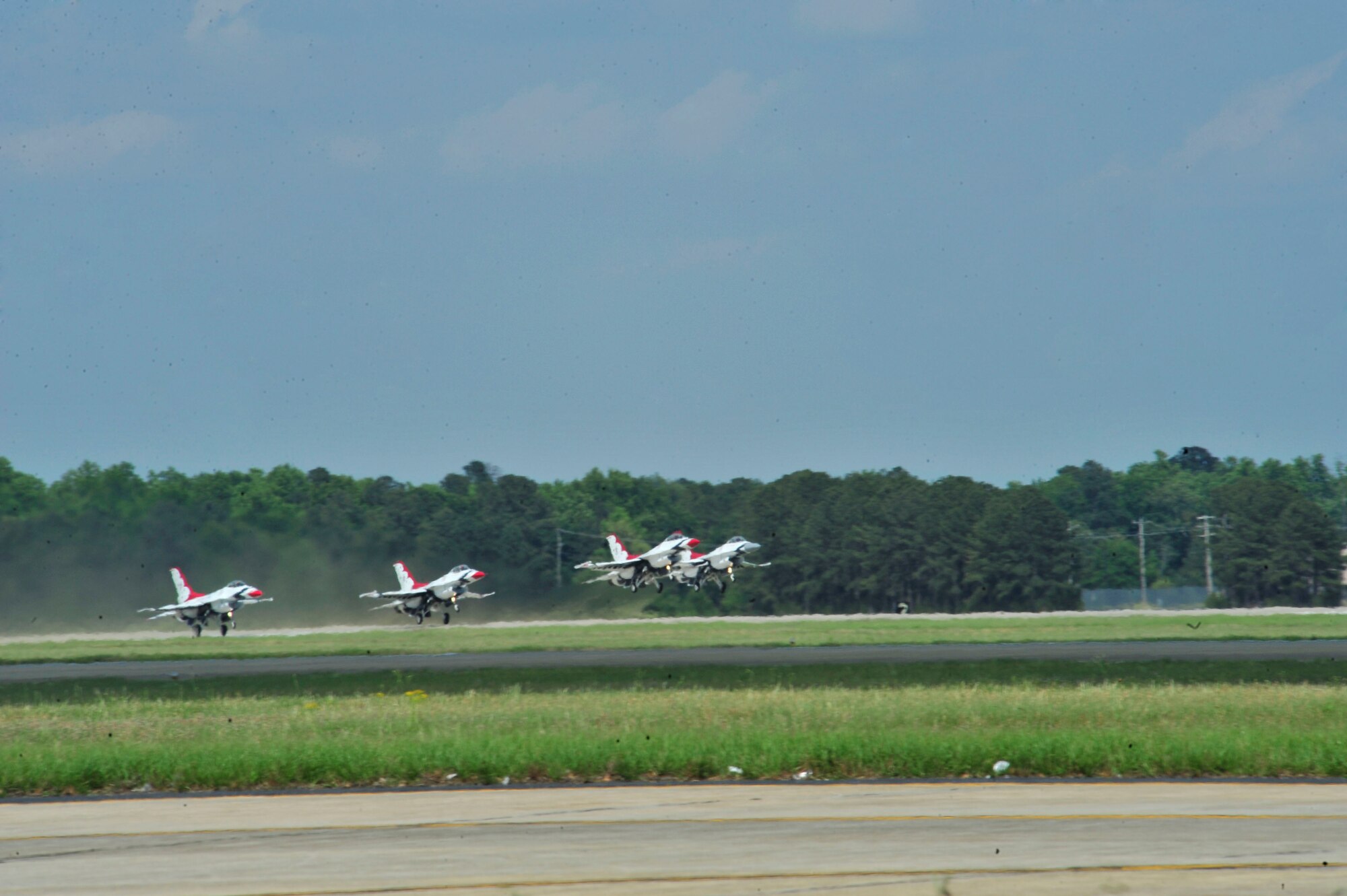 - U.S. Air Force Air Demonstration Squadron "Thunderbirds" takeoff from Shaw Air Force Base, S.C., during the 2012 Shaw Air Expo on May 5, 2012.  The Thunderbirds performance, along with the U.S. Army Golden Knights, were the highlight the aerial acts that participated in the biennial event. (U.S. Air Force photo by Airman Nicole Sikorski/Released) 