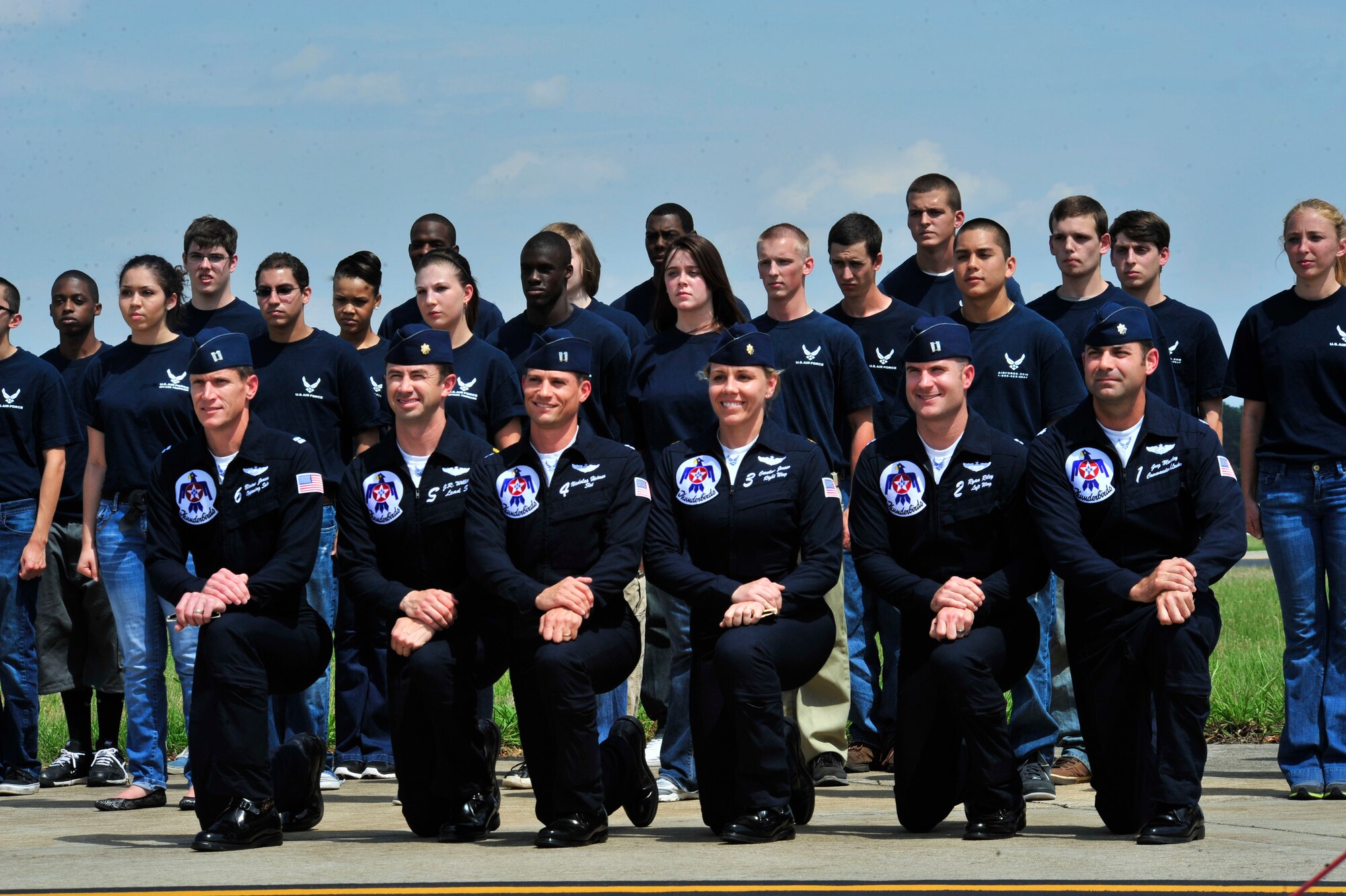 U.S. Air Force Air Demonstration Squadron "Thunderbirds" pose for a photo with recent enlistees while at the Shaw Air Expo, Shaw Air Force Base, S.C., May 5, 2012. In addition to more than 80 air demonstrations each year, the Thunderbirds also conduct enlistments, re-enlistments and speak at local high schools when visiting an area near one of their performances. (U.S. Air Force photo by Airman Nicole Sikorski/Released) 