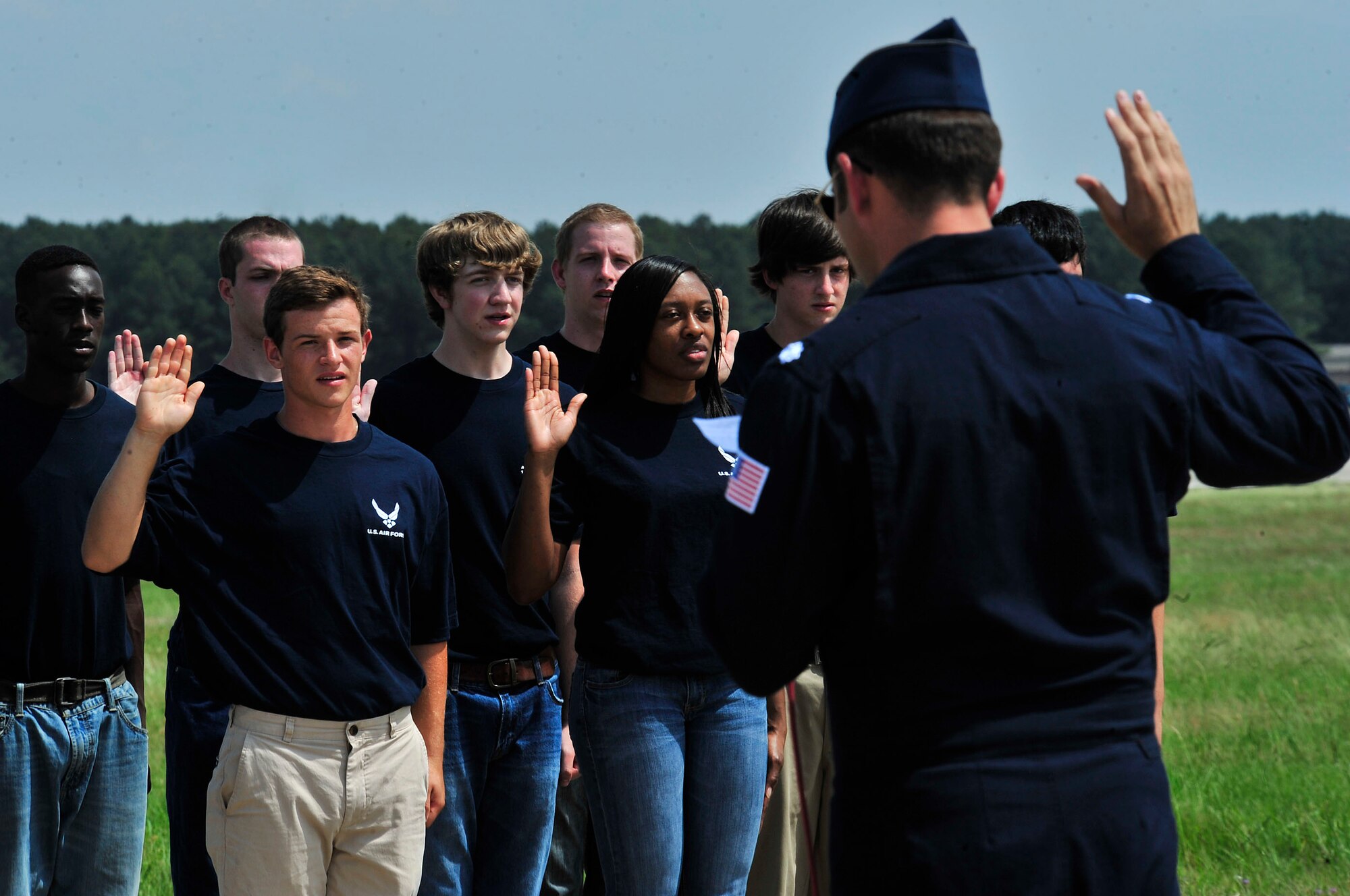 U.S. Air Force Lt. Col. Gregory Mosley, U.S. Air Force Air Demonstration Squadron "Thunderbirds" commander, reads the oath of enlistment during the 2012 Shaw Air Expo, Shaw Air Force Base, S.C., May 5, 2012. After taking this oath, these soon to be Airmen will be departing for U.S. Air Force Basic Military Training.(U.S. Air Force photo by Airman Nicole Sikorski/Released)