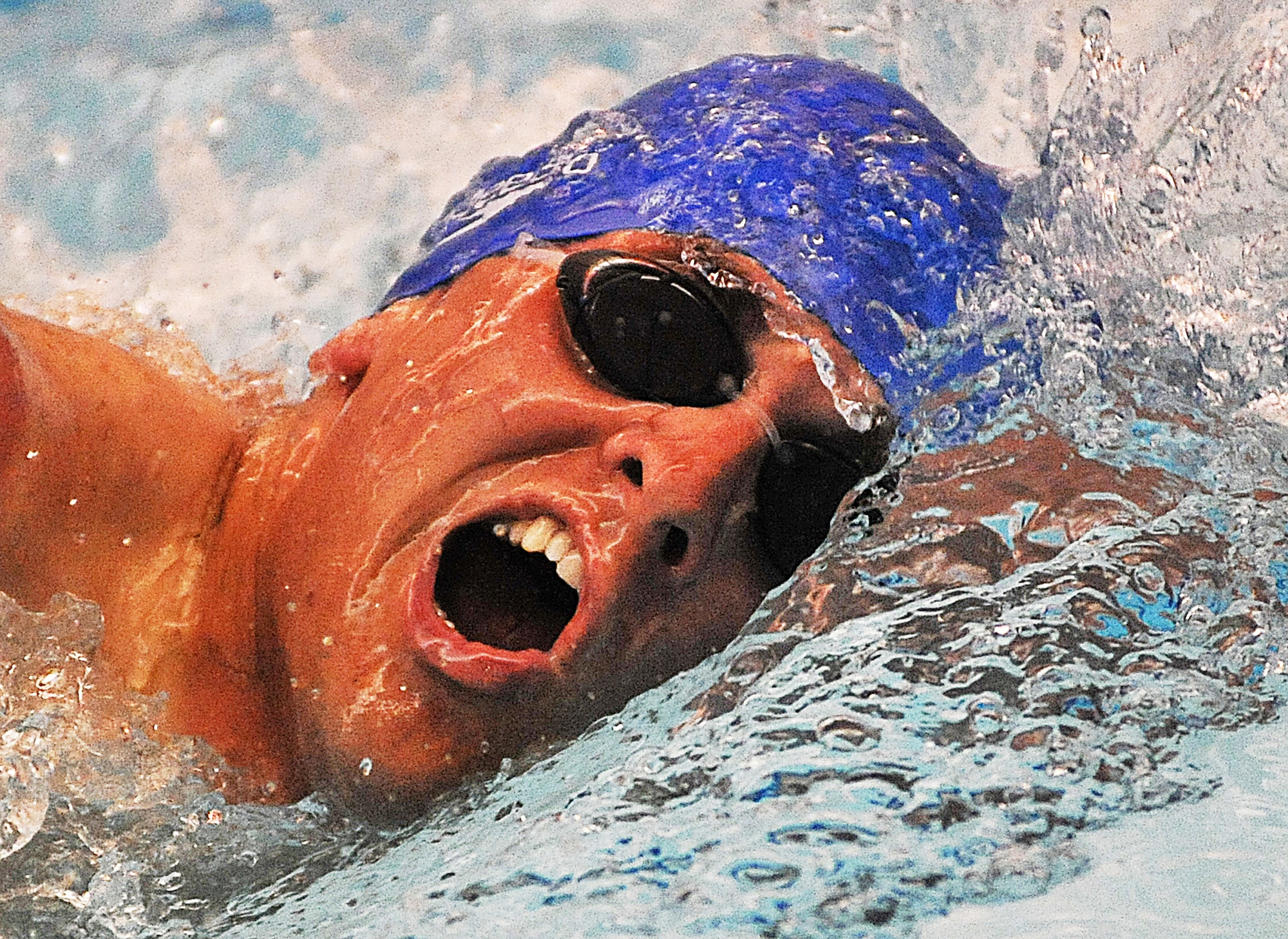 U.S. Air Force 1st Lt. Ryan McGuire heads toward the finish line as he takes part in a swimming competition during Warrior Games 2012 at the U.S. Air Force Academy in Colorado Springs, Colo., May 5, 2012. McGuire is with the Air Force team. (U.S. Air Force photo by Val Gempis/Released)