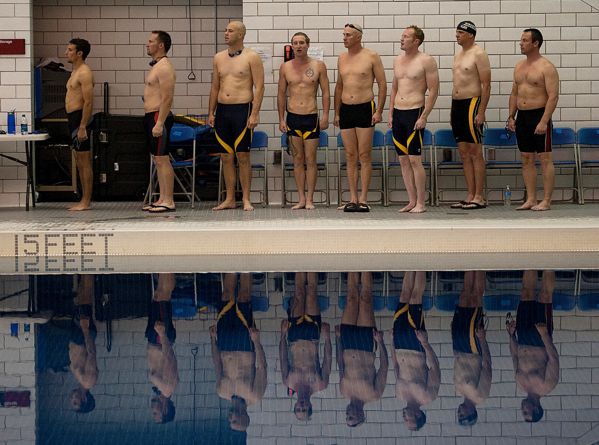 U.S. Air Force Tech. Sgt. Marc Esposito, far left, and other athletes stand at attention during a medal ceremony of the swimming competitions of Warrior Games 2012 at the U.S. Air Force Academy in Colorado Springs, Colo., May 5, 2012. Esposito is with the Special Operations Command team. (U.S. Air Force photo by Val Gempis/Released)