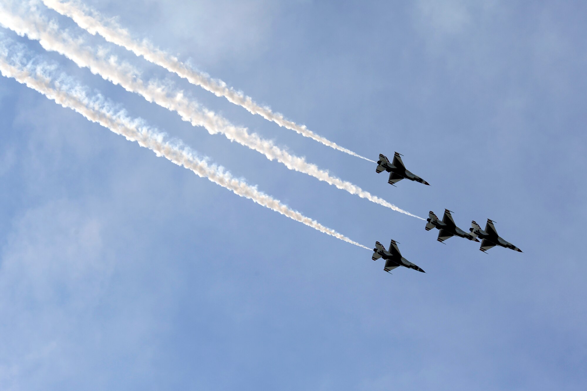 U.S. Air Force Thunderbirds, the elite Air Force Demonstration team, perform an aerial maneuver during their performance at the Shaw Air Expo at Shaw Air Force Base, S.C., May 5, 2012. The Shaw Air Expo was headlined by the Thunderbirds and featured static displays and other aerobatic performers. Thousands of visitors came to Shaw for the air show. (U.S. Air Force photo by Senior Airman Daniel Phelps/Released)