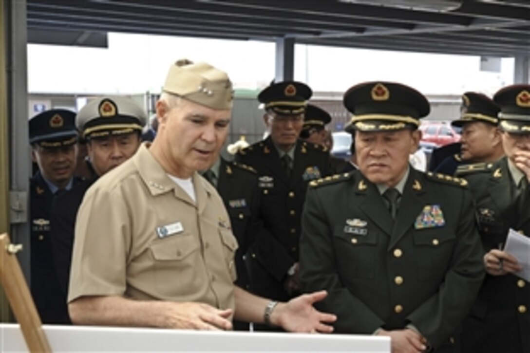 U.S. Navy Vice Adm. Richard W. Hunt, commander of U.S. Naval Surface Forces, discusses humanitarian assistance efforts conducted by the U.S. Navy with Chinese Minister of National Defense Gen. Liang Guanglie on Naval Amphibious Base Coronado, Calif., May 5, 2012. Liang is visiting U.S. military bases and meeting with U.S. military leaders to discuss U.S.-Chinese cooperation in areas of mutual interest including humanitarian assistance and disaster relief and counter-piracy measures.