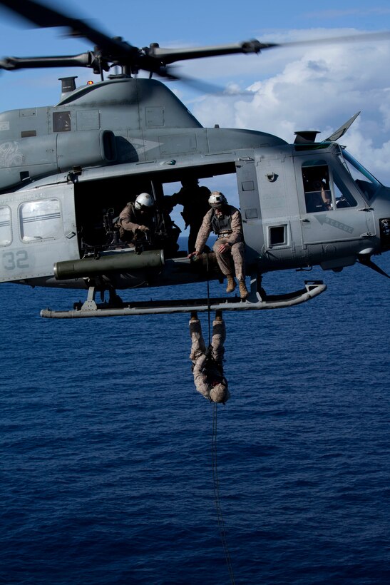 A reconnaissance Marine with Battalion Landing Team 3/1 rappels from a UH-1Y Huey flown by pilots with Marine Medium Helicopter Squadron 268 (Reinforced) onto USS Makin Island's flight deck here May 6. The landing team serves as the ground combat element with the 11th Marine Expeditionary Unit. The unit embarked USS Makin Island, USS New Orleans and USS Pearl Harbor in San Diego Nov. 14 beginning a seven-month deployment to the Western Pacific, Horn of Africa and Middle East regions.