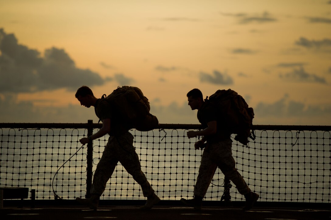 Navy Lt. James E. Lamb, left, and Sgt. Ryan Eskandary exercise aboard USS Pearl Harbor May 6. Lamb is a Minneapolis native and serves as a firepower control team leader. Eskandary hails from St. Paul, Minn., and serves as a forward observer. Both serve with the 11th Marine Expeditionary Unit’s command element. The unit embarked USS Makin Island, USS New Orleans and USS Pearl Harbor in San Diego Nov. 14 beginning a seven-month deployment to the Western Pacific, Horn of Africa and Middle East regions.