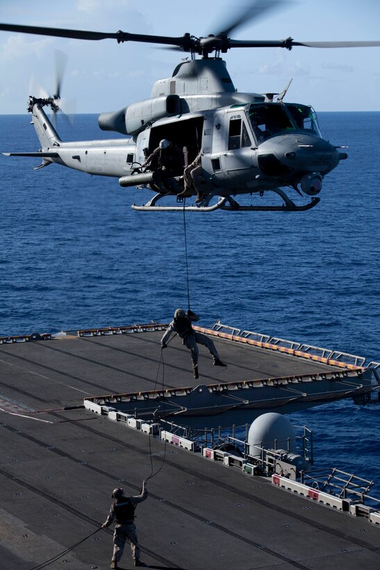 A reconnaissance Marine with Battalion Landing Team 3/1 rappels from a UH-1Y Huey flown by pilots with Marine Medium Helicopter Squadron 268 (Reinforced) onto USS Makin Island's flight deck here May 6. The landing team serves as the ground combat element with the 11th Marine Expeditionary Unit. The unit embarked USS Makin Island, USS New Orleans and USS Pearl Harbor in San Diego Nov. 14 beginning a seven-month deployment to the Western Pacific, Horn of Africa and Middle East regions.