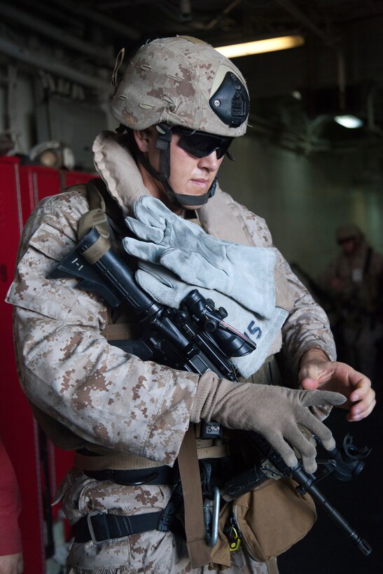 Reconnaissance Marine Sgt. Zachary Lira prepares to rappel onto USS Makin Island's flight deck from a UH-1Y Huey flown by pilots with Marine Medium Helicopter Squadron 268 (Reinforced) here May 6. The 25-year-old Apache Jct., Ariz., native serves as a team leader with Battalion Landing Team 3/1, the ground combat element with the 11th Marine Expeditionary Unit. The unit embarked USS Makin Island, USS New Orleans and USS Pearl Harbor in San Diego Nov. 14 beginning a seven-month deployment to the Western Pacific, Horn of Africa and Middle East regions.