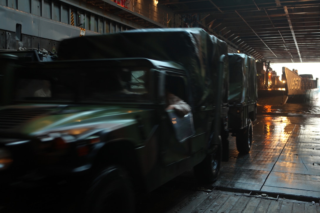 U.S. Marines from Security Cooperation Task Force (SCTF) Africa Partnership Station 12(ASP-12), conduct amphibious operations and embarkation training to the U.S.S. Fort McHenery (LSD-12) on May 7, 2012 aboard Onslow beach,  Camp Lejeune N.C., This evolution was designs to refresh both the U.S Marines and the sailors of LSD-12  on  amphibious operations in support on contingency missions APS-12 may face on  their upcoming deployment  to Africa. (U.S. Marine Corps. Photo by Staff Sgt. Jemssy  Alvarez Jr./Not  Released)