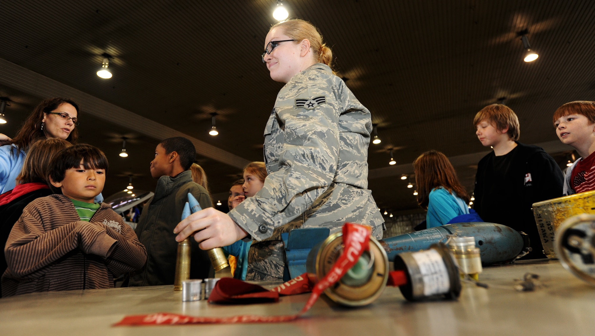 U.S. Air Force Senior Airman Heather Shields, 35th Maintenance Group squadron lead crew member, shares some unique facts about military bullets, projectiles and fuses in Hangar 911 with Sollars Elementary School’s third grade students at Misawa Air Base, Japan, May 3, 2012. Approximately 10 servicemembers volunteered their time to educate the students about what they do in their respective line of work and why it is important. (U.S. Air Force photo by Airman Kenna Jackson/Released)
