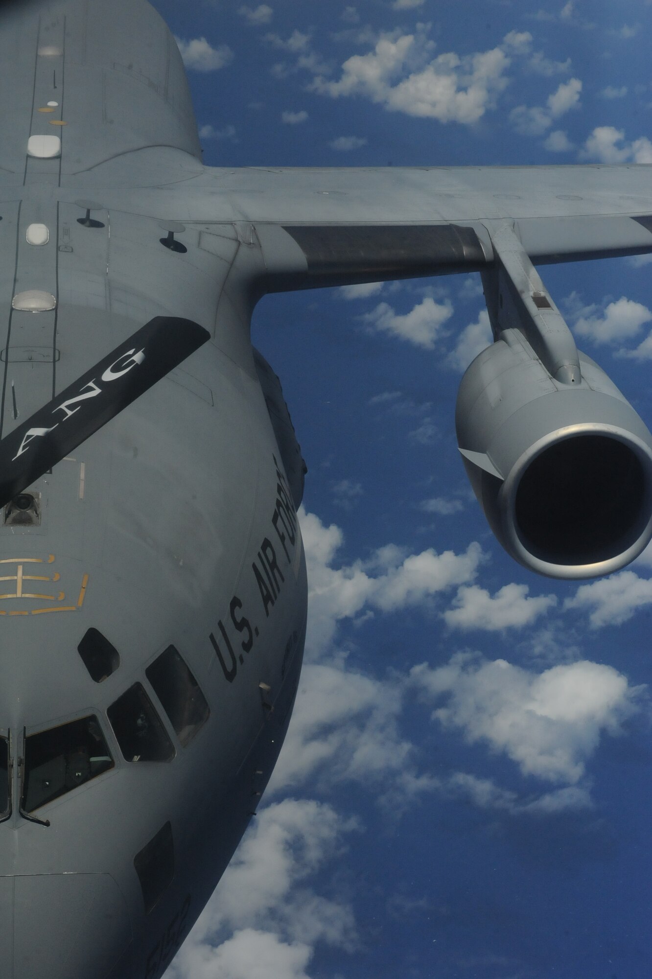 A C-17 Globemaster III from the 535th Airlift Squadron, prepares to connect to a 154th Air Refueling Squadron KC-135 Stratotanker during a  Reserve Officer Training Corps incentive flight hosting cadets from U.S. Air Force ROTC Detachment 175 at the University of Hawaii May 4 at Joint Base Pearl Harbor-Hickam, Hawaii. The flight, which featured 7 cadets from both the U.S. Army and U.S. Air Force, served as an incentive flight for the cadets while simultaneously providing them a glimpse of the operational military. (U.S. Air Force photo by Staff Sgt. Nathan Allen)
